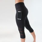 Spodnie do jogi o długości do łydek Sportowe spodnie Capri / siłownia Legginsy z czarnej siatki z wysokim stanem dostawca